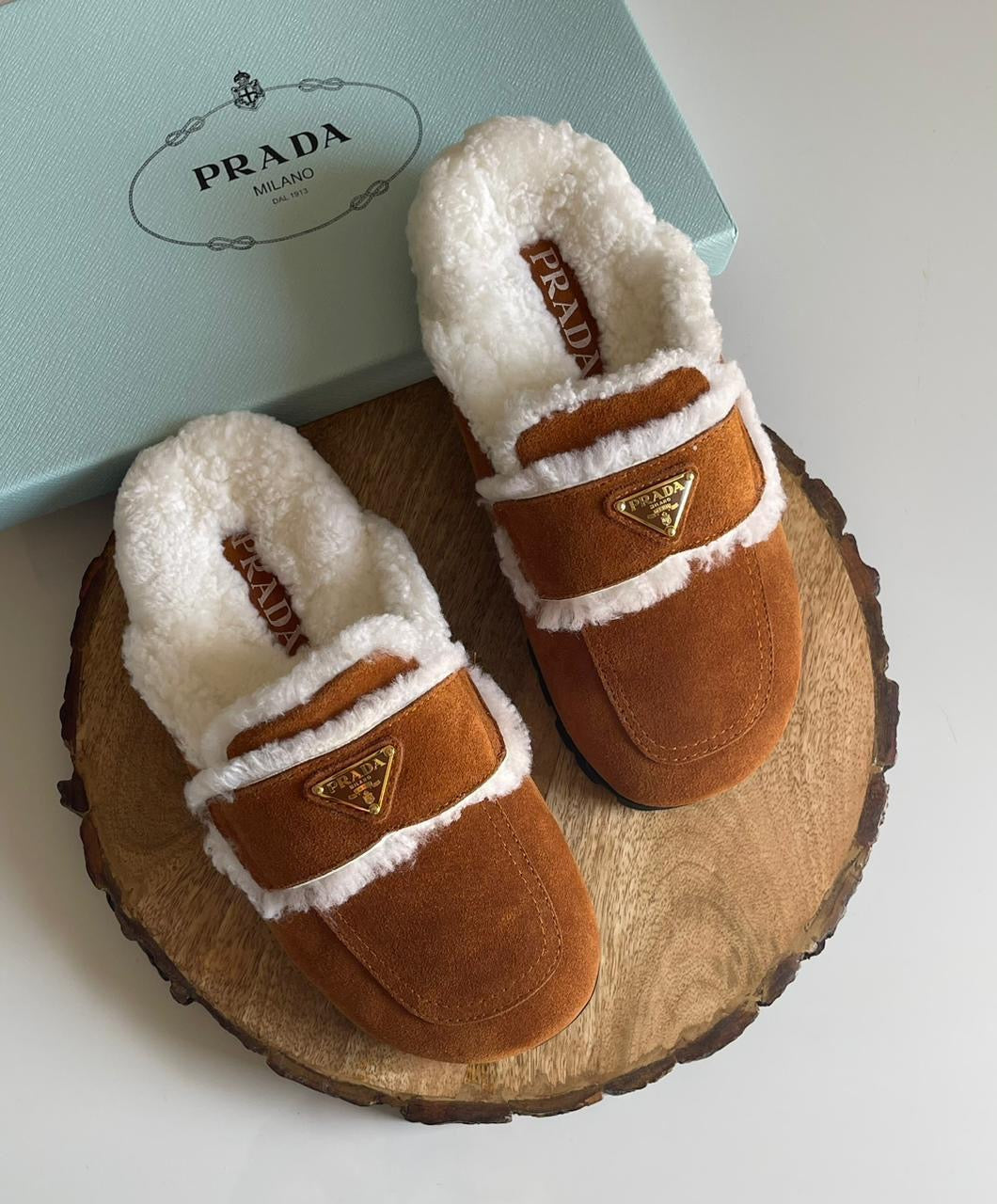 Prada mules with fur