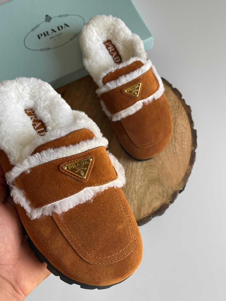 Prada mules with fur