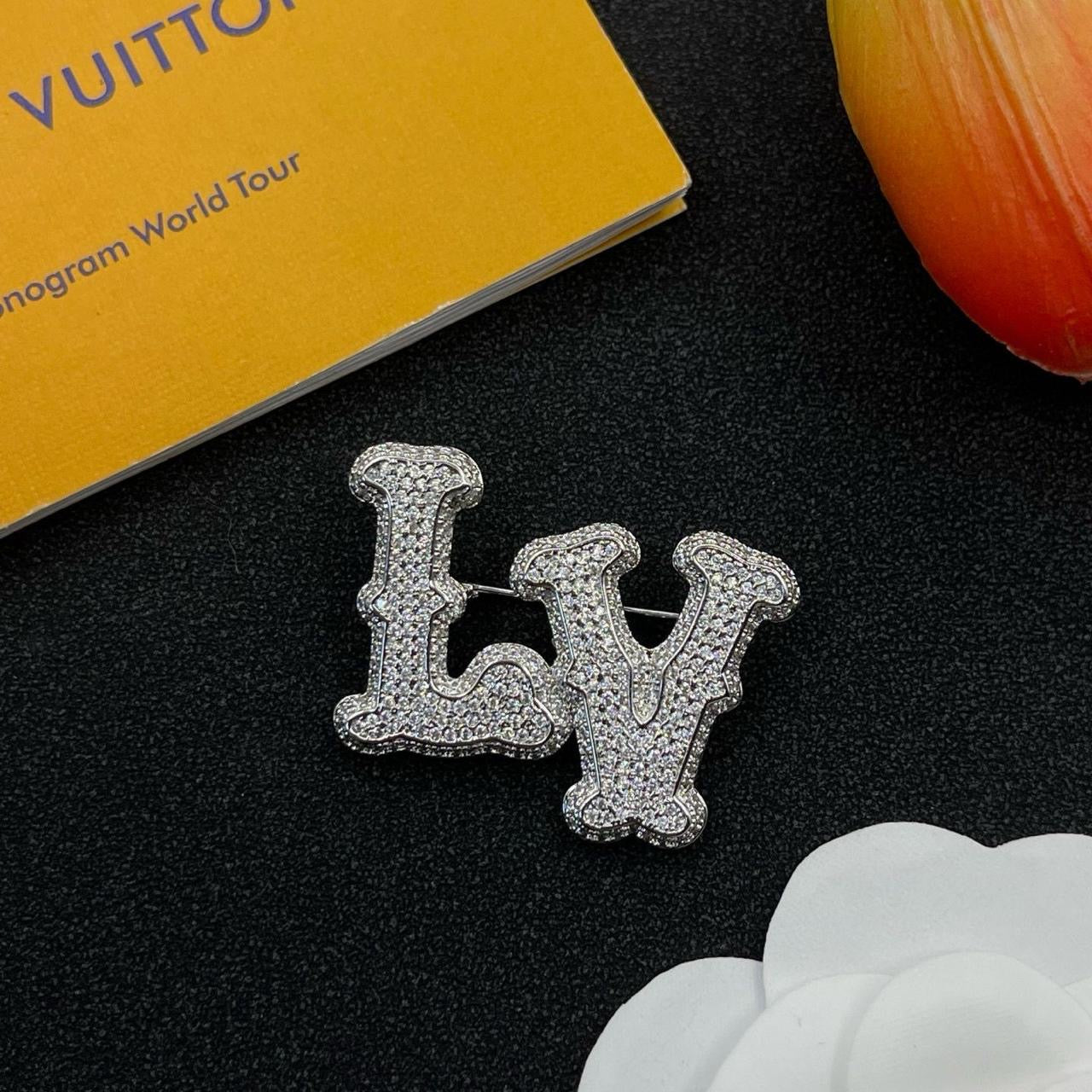Lv brooch