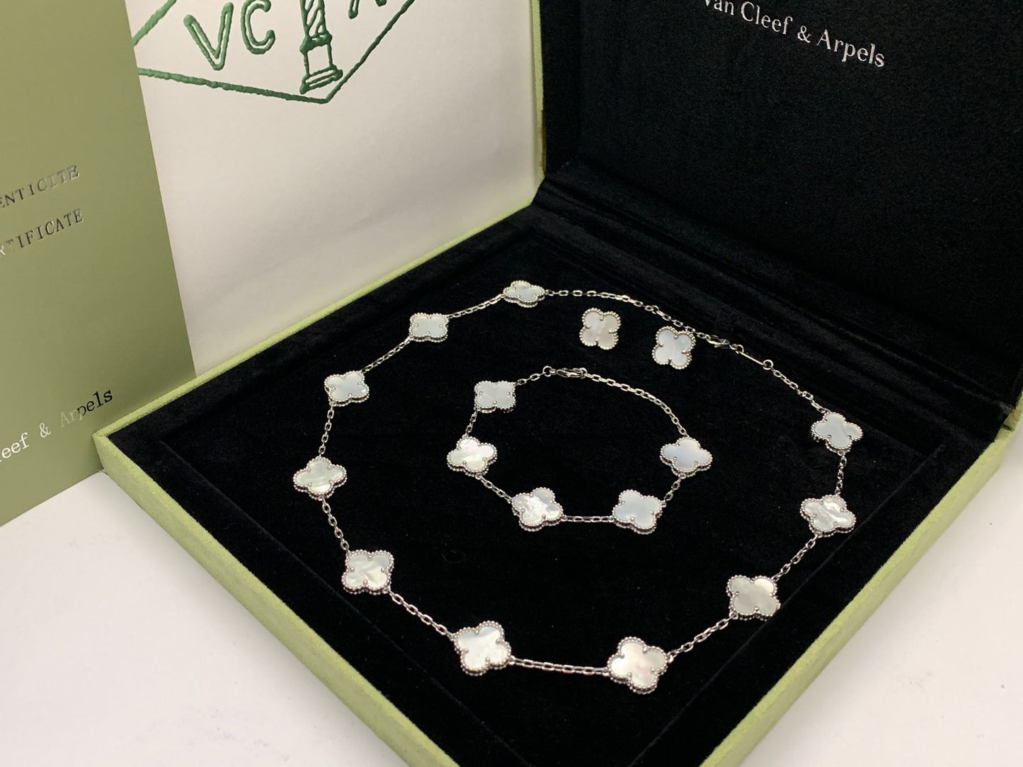 Van cleef jewelry set silver color