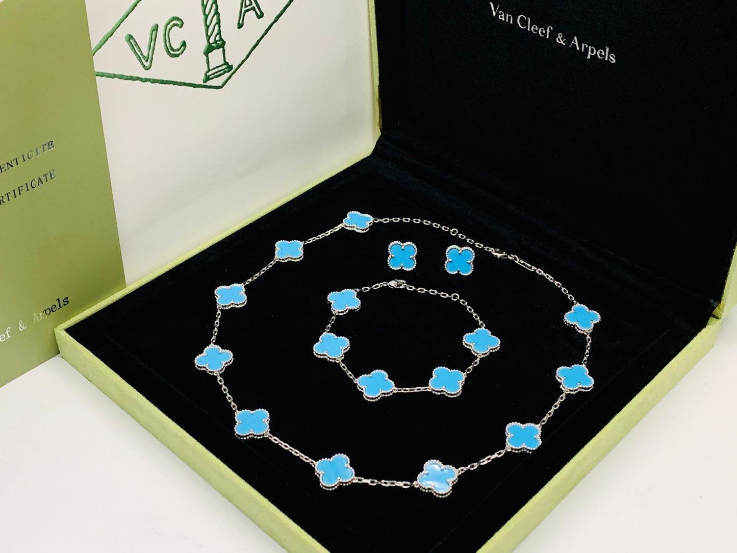Van cleef jewelry set silver color