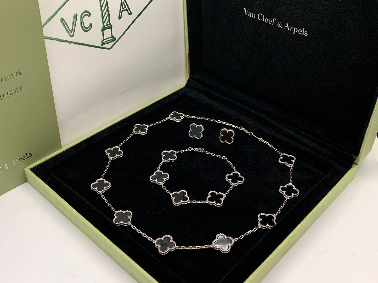 Van cleef jewelry set silver color