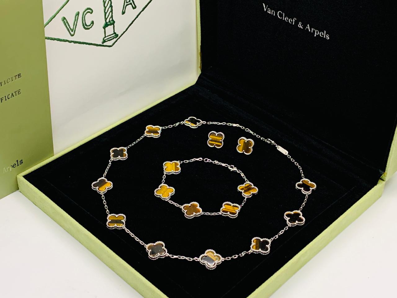 Van cleef jewelry set silver color