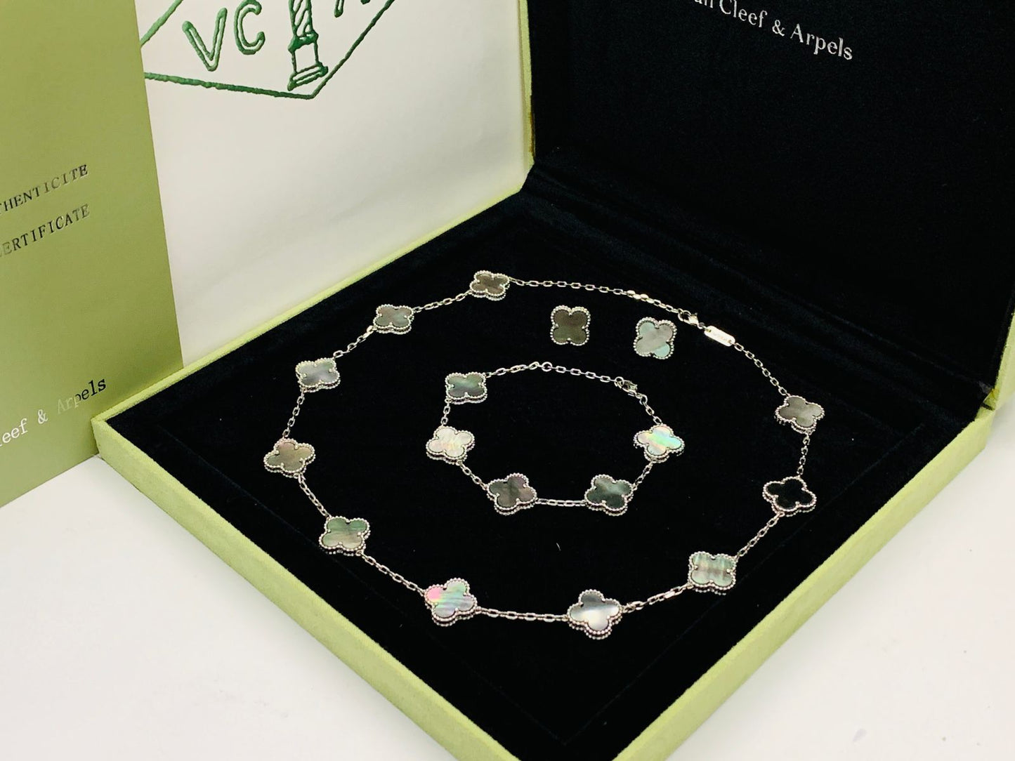 Van cleef jewelry set silver color