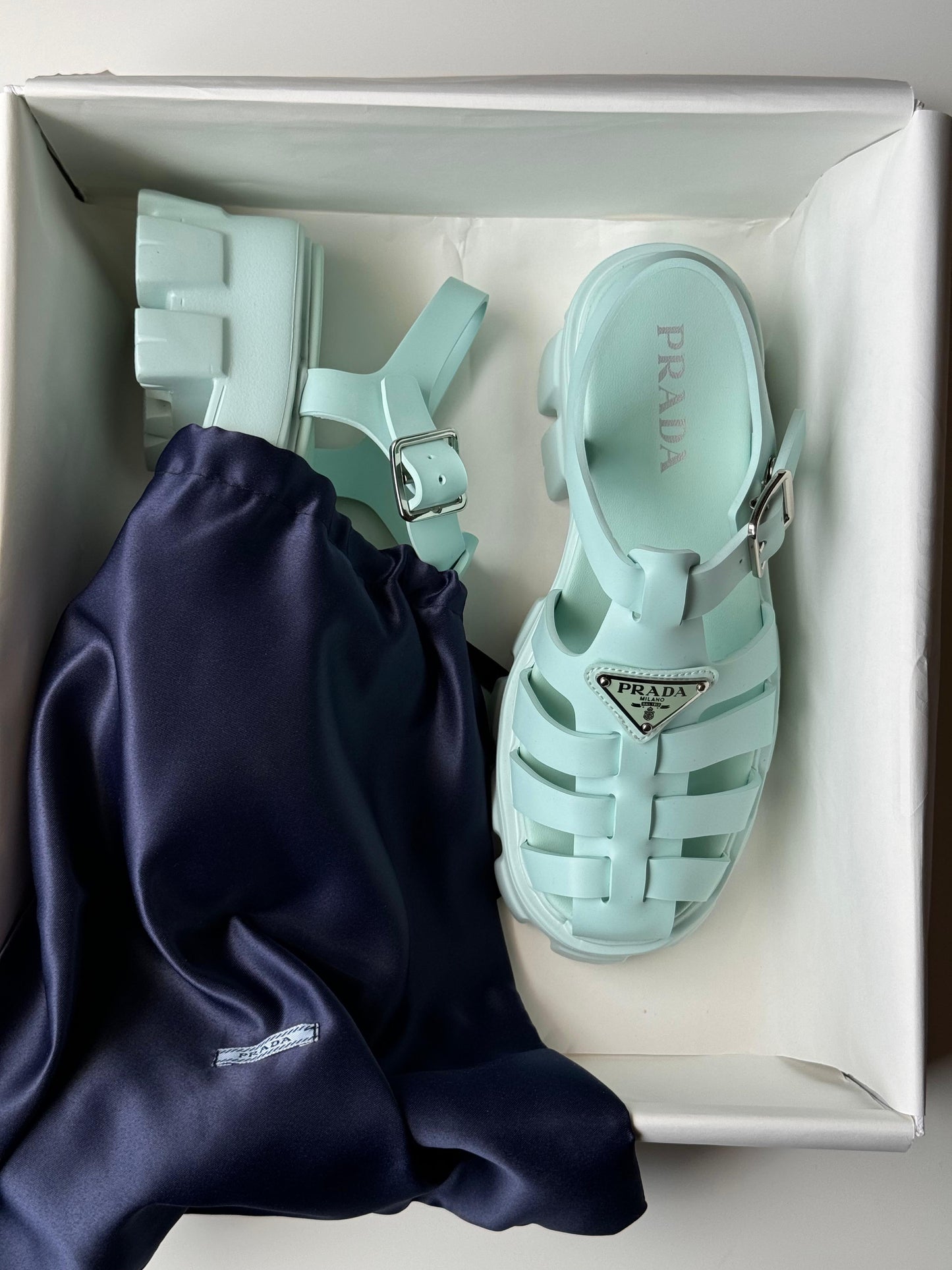 Prada sandals.