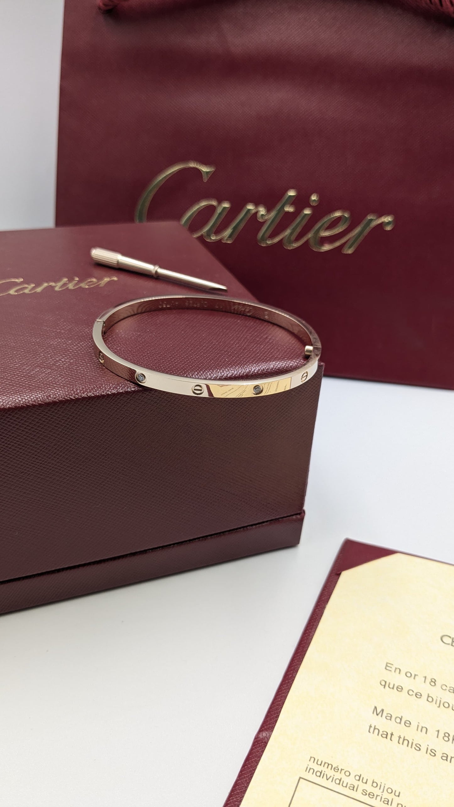 Cartier bangle ( with acrews & stones )