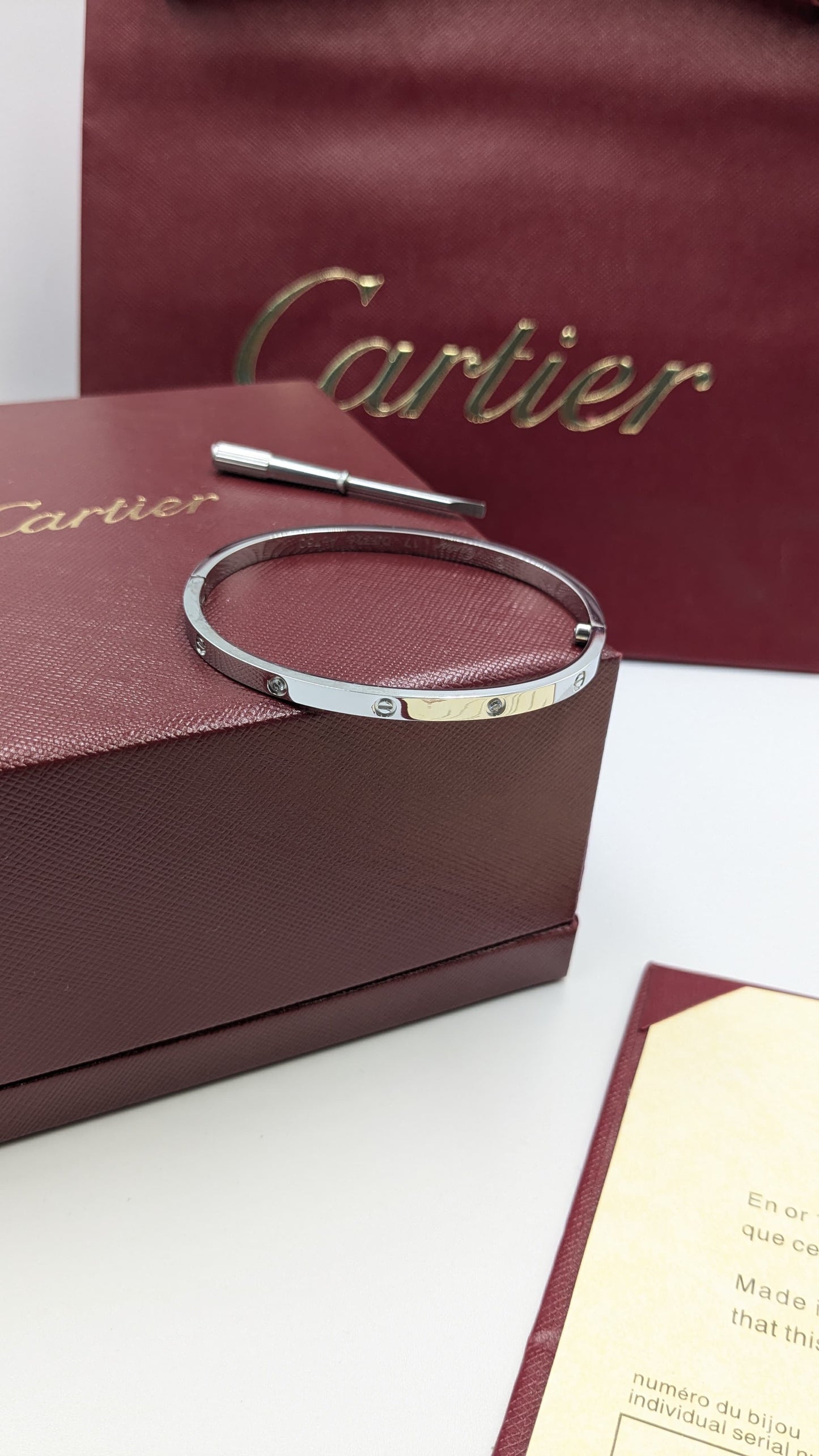 Cartier bangle ( with acrews & stones )