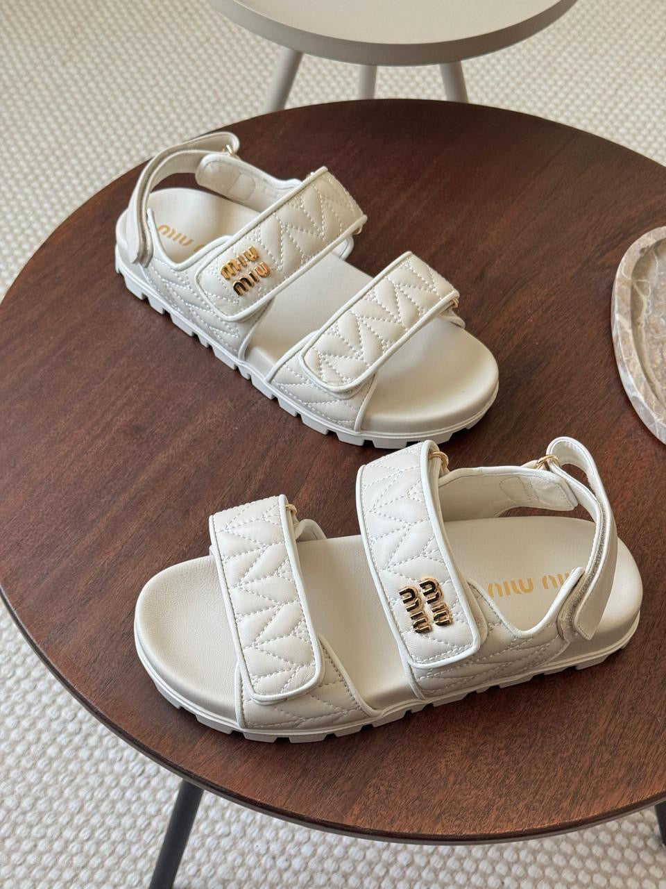 Miu miu sandals.