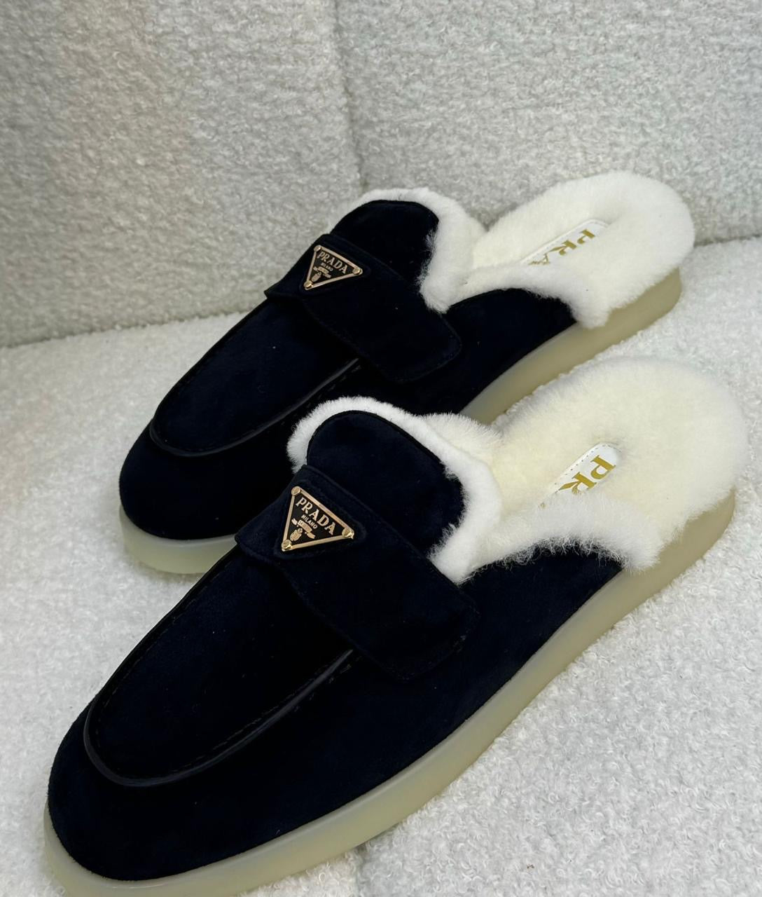 Prada mules with fur