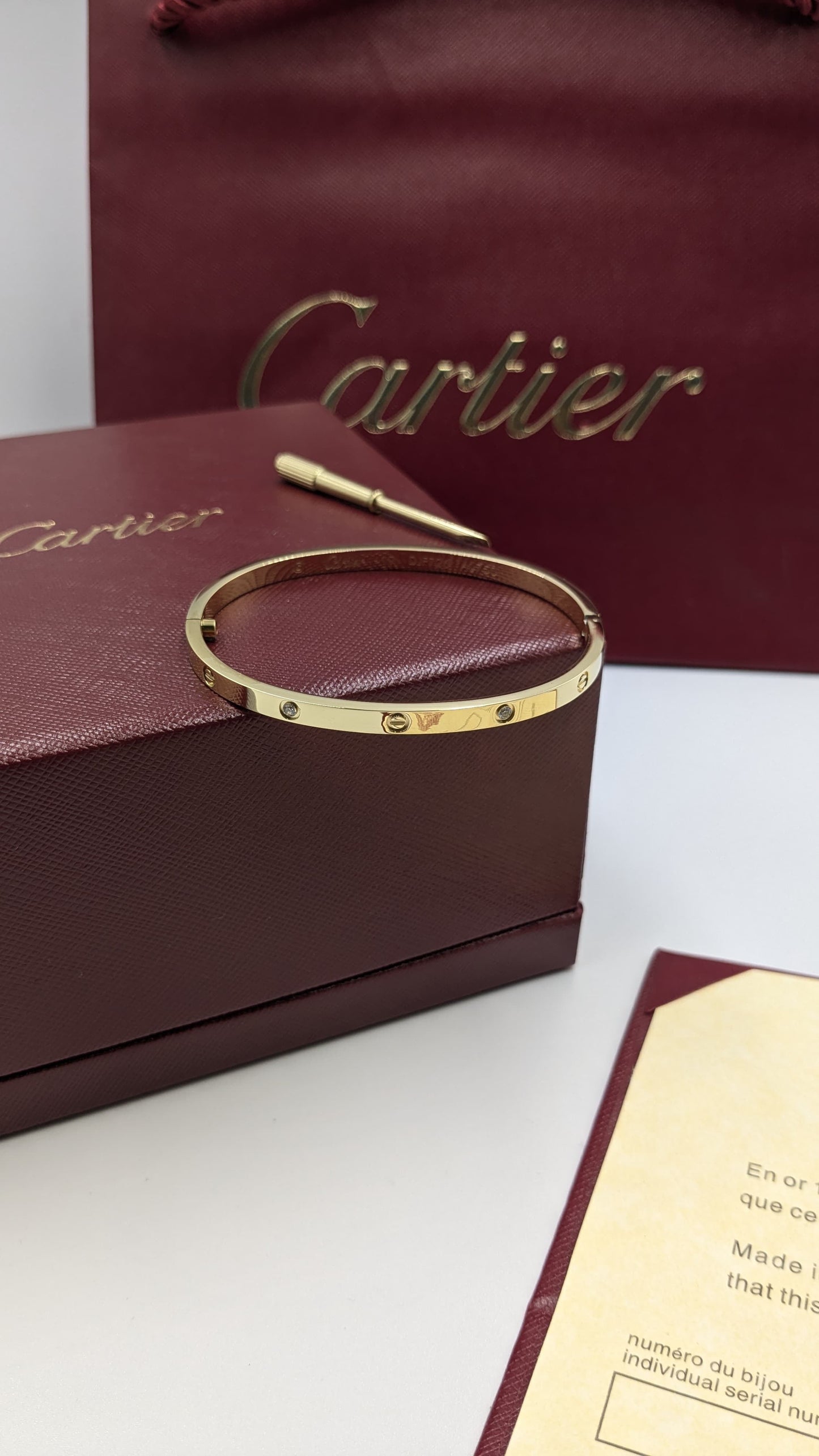 Cartier bangle ( with acrews & stones )