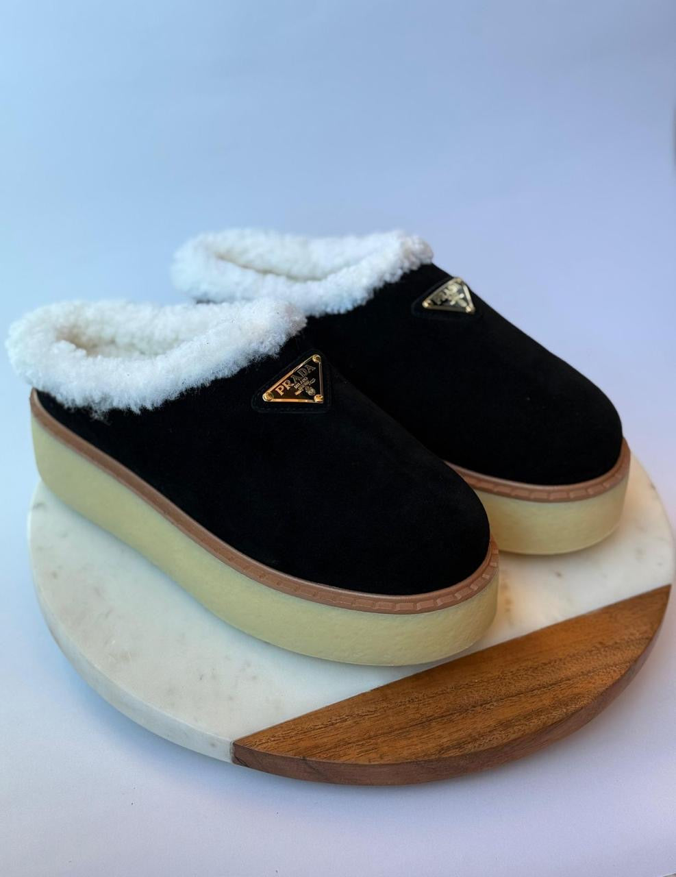 Prada mules with fur