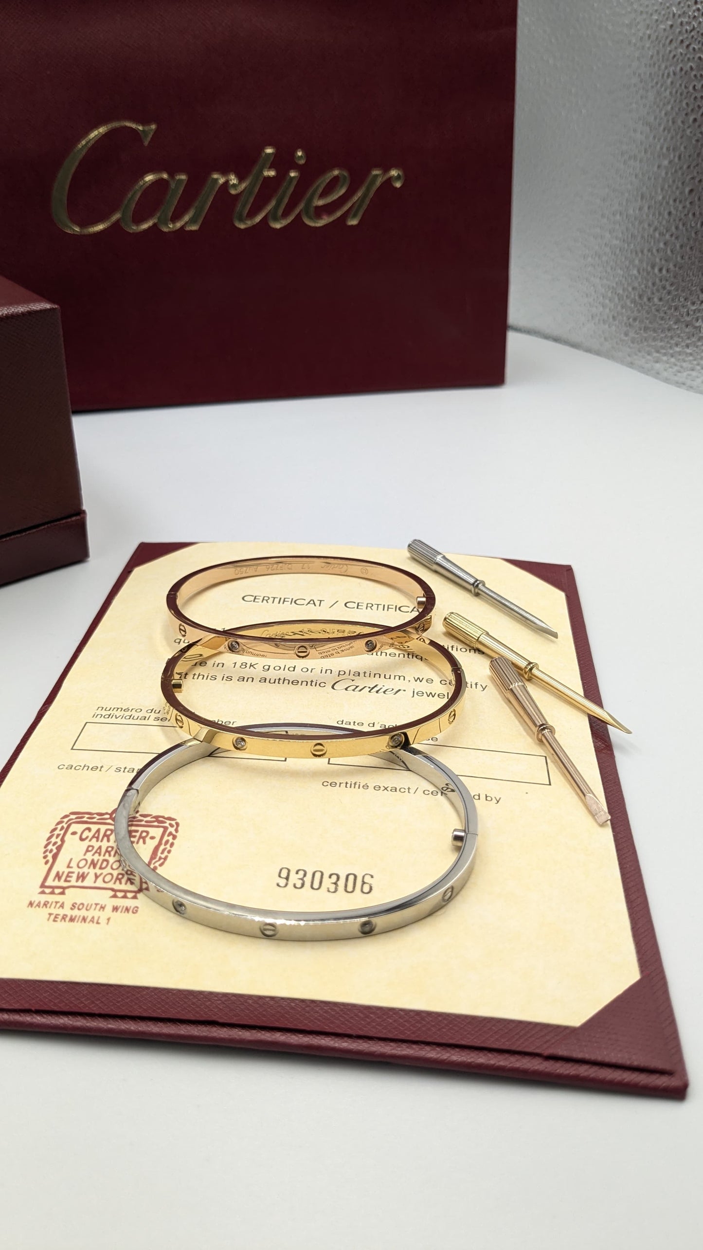 Cartier bangle ( with acrews & stones )