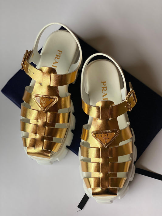 Prada sandals. Gold