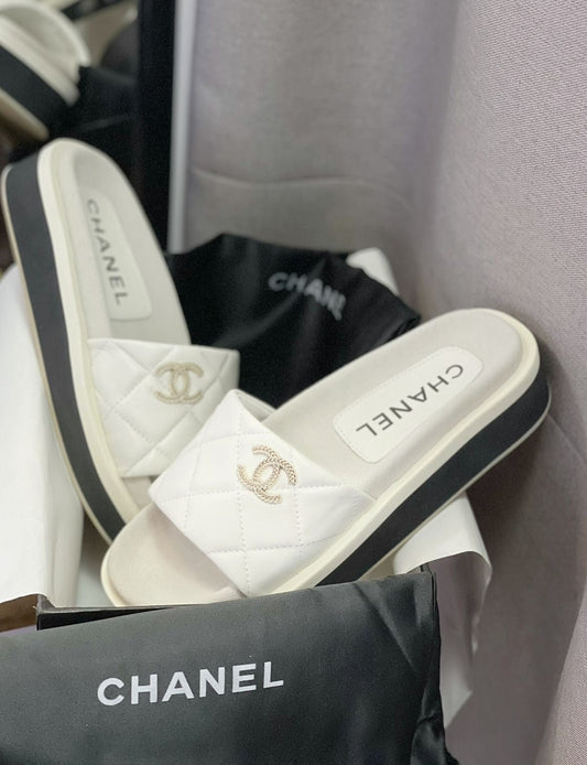 Chanel slippers black and white