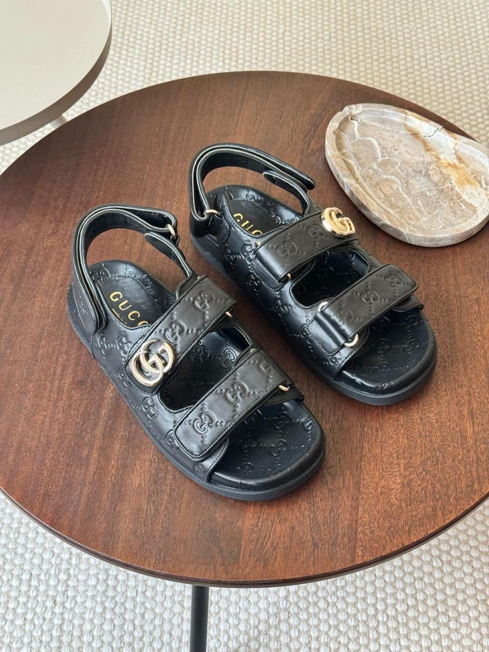 Gucci sandals.